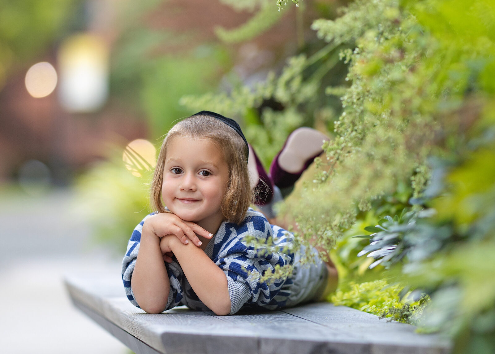 A child smiling — natural light portrait by Wink Portraits